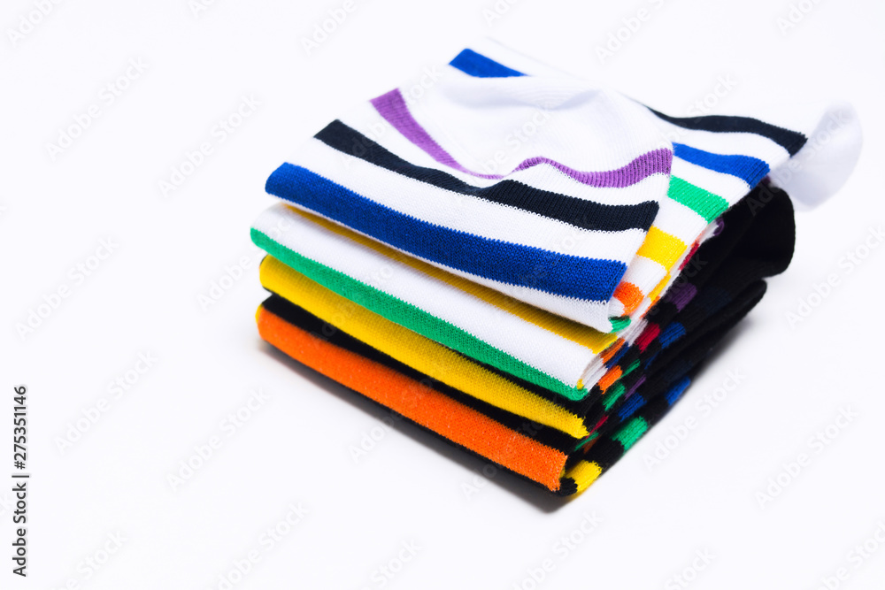 Stack of colorful striped socks over white background Stack of colorful striped socks over white background