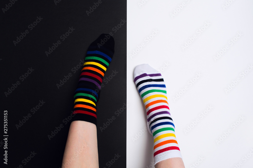 Two nagative legs with white and black striped colorful socks with negative background with copy space Two nagative legs with white and black striped colorful socks with negative background with copy space