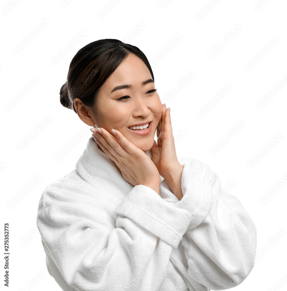 Portrait of beautiful Asian woman in bathrobe isolated on white. Spa treatment Portrait of beautiful Asian woman in bathrobe isolated on white. Spa treatment