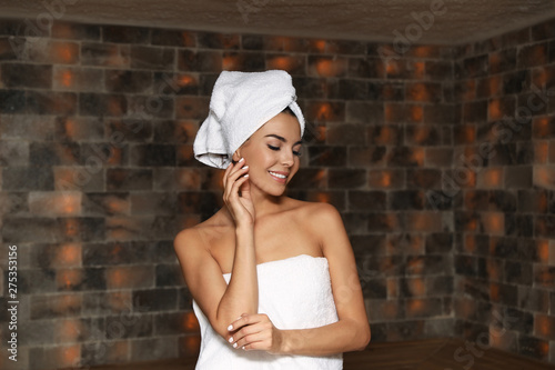 Portrait of young woman in salt sauna at luxury spa center