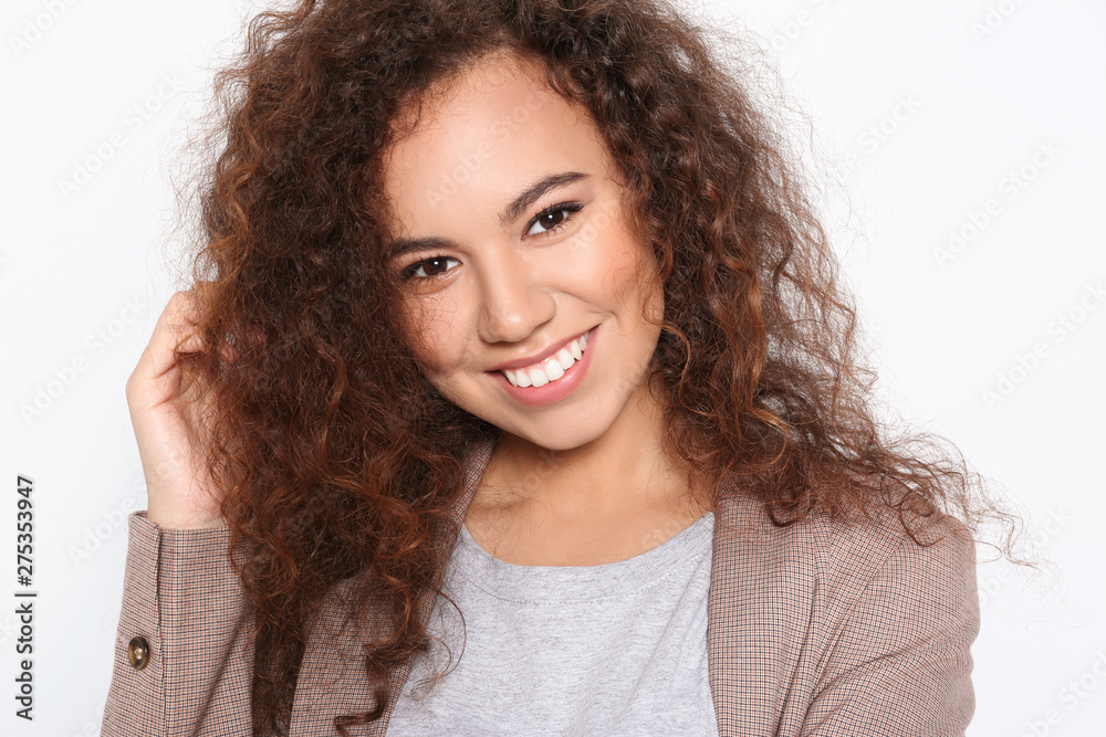 Young African-American woman with beautiful face on white background, closeup Young African-American woman with beautiful face on white background, closeup