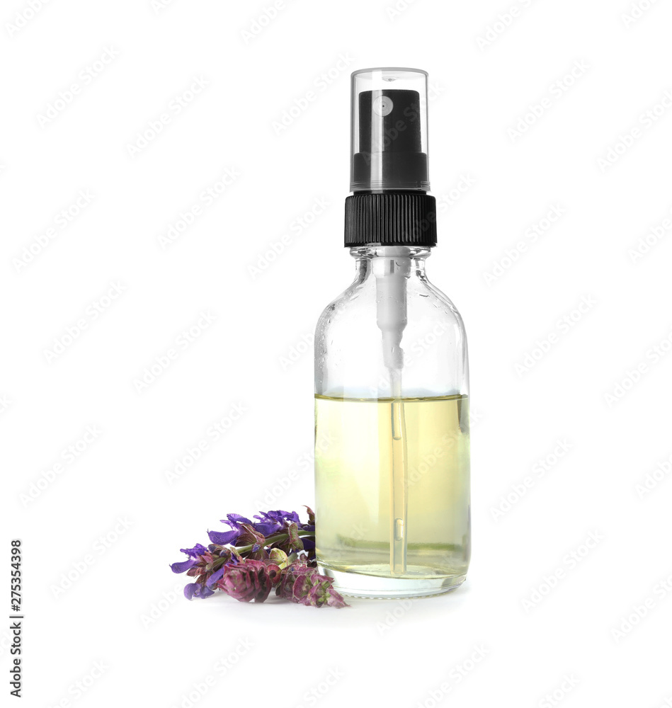 Bottle of herbal essential oil and sage flowers isolated on white Bottle of herbal essential oil and sage flowers isolated on white