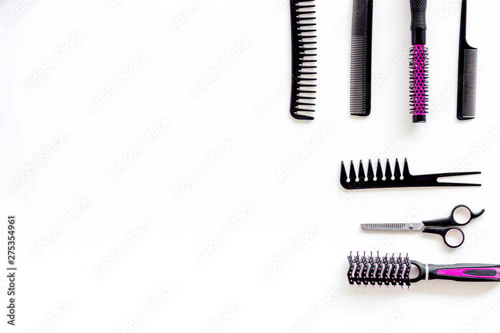 Combs and pink hairdresser tools in beauty salon work desk on white background top view mockup Combs and pink hairdresser tools in beauty salon work desk on white background top view mockup