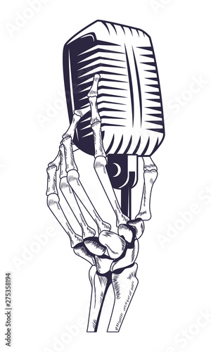 antique microphone and skeleton hand