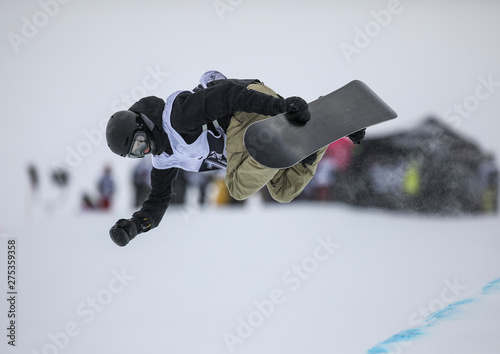 Vászonkép Snowboarder does a trick