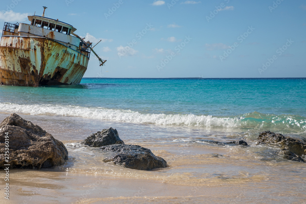 Shipwreck on shoreline in Caribbean sea