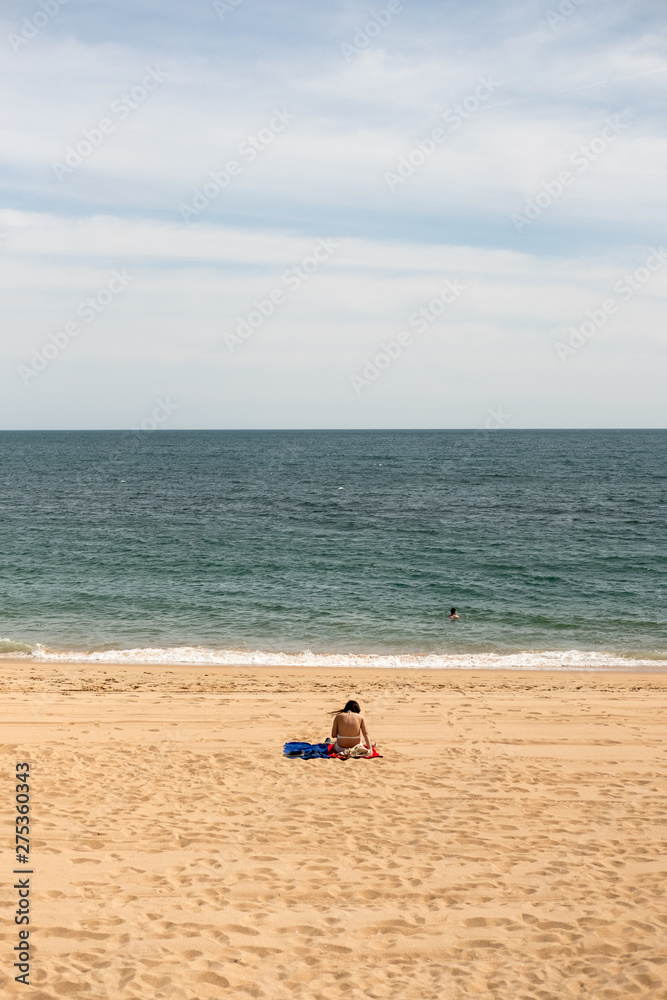 The only woman in the beach in Algarve, Portugal