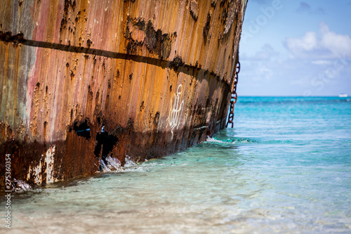 Rusty shipwreck in clear Caribbean waters