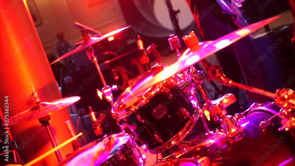 the drummer plays the drum set in the club