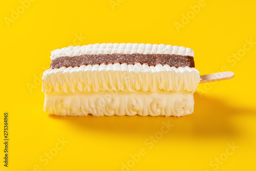side view fresh chocolate and milkshake flavor popsicle on a yellow background