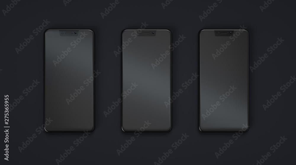 Three smartphones with empty screen on dark background. Three smartphones with empty screen on dark background.