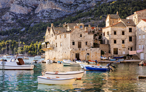 Canvas Print Sea village life in the town of Vis in Croatia with boats in the harbor