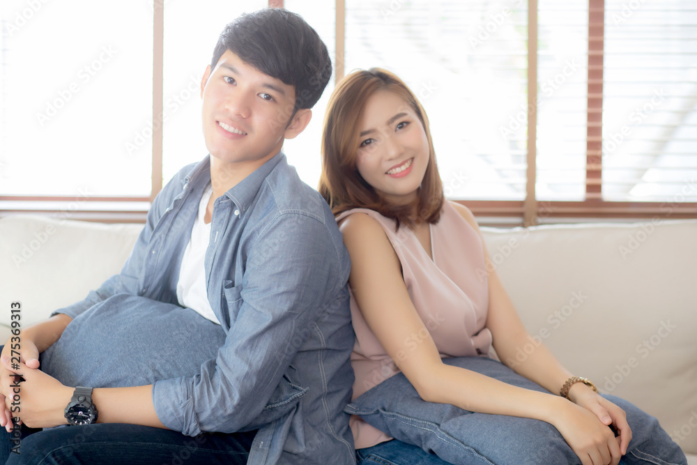 Beautiful portrait young asian couple relax and satisfied together in living room at home, family sitting couch confident with cheerful and happy with relationship, man and woman dating. Beautiful portrait young asian couple relax and satisfied together in living room at home, family sitting couch confident with cheerful and happy with relationship, man and woman dating.