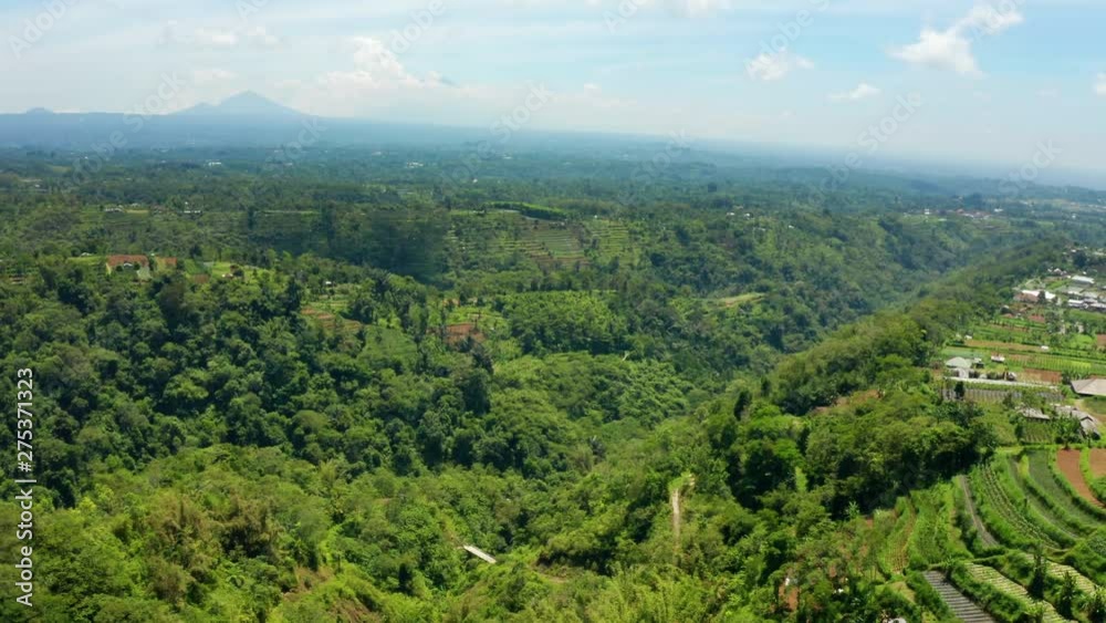 Flying over farms in the countryside of Bali. Flying over farms in the countryside of Bali.
