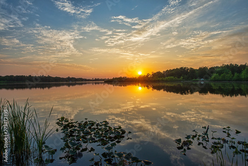 Fototapeta Naklejka Na Ścianę i Meble -  Sunset over Calm Water