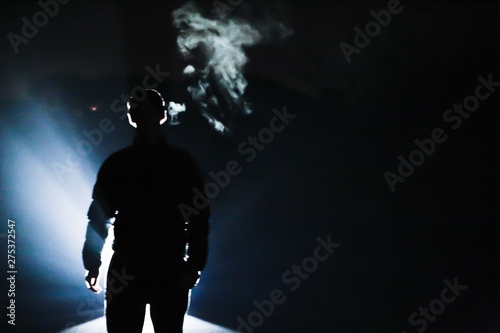 silhouette of a man in front of light