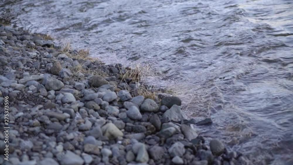 Gently flowing stream on a rocky bank. Gently flowing stream on a rocky bank.