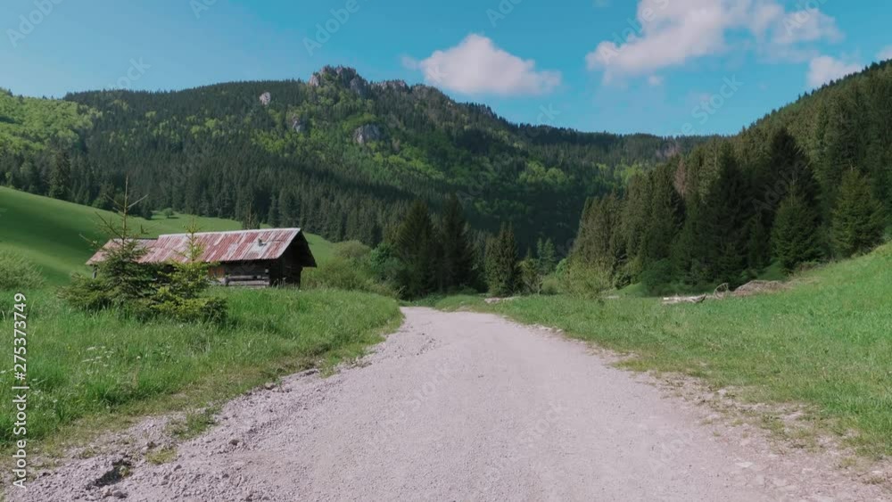 View of a rural hut surrounded by mountains of Velka Fatra National Park in Slovakia View of a rural hut surrounded by mountains of Velka Fatra National Park in Slovakia