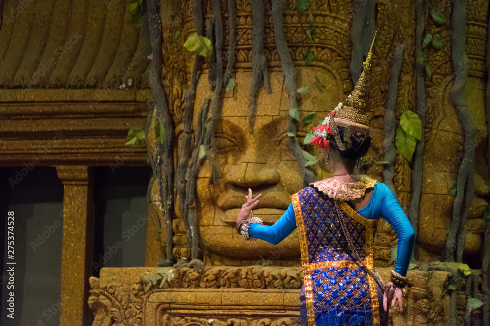Back view of actress showing Khon dancing performance in Siem Reap, Cambodia. The UNESCO announced Khon, the Thai masked dance drama, and Lkhon Khol of Cambodia are intangible cultural heritage. 