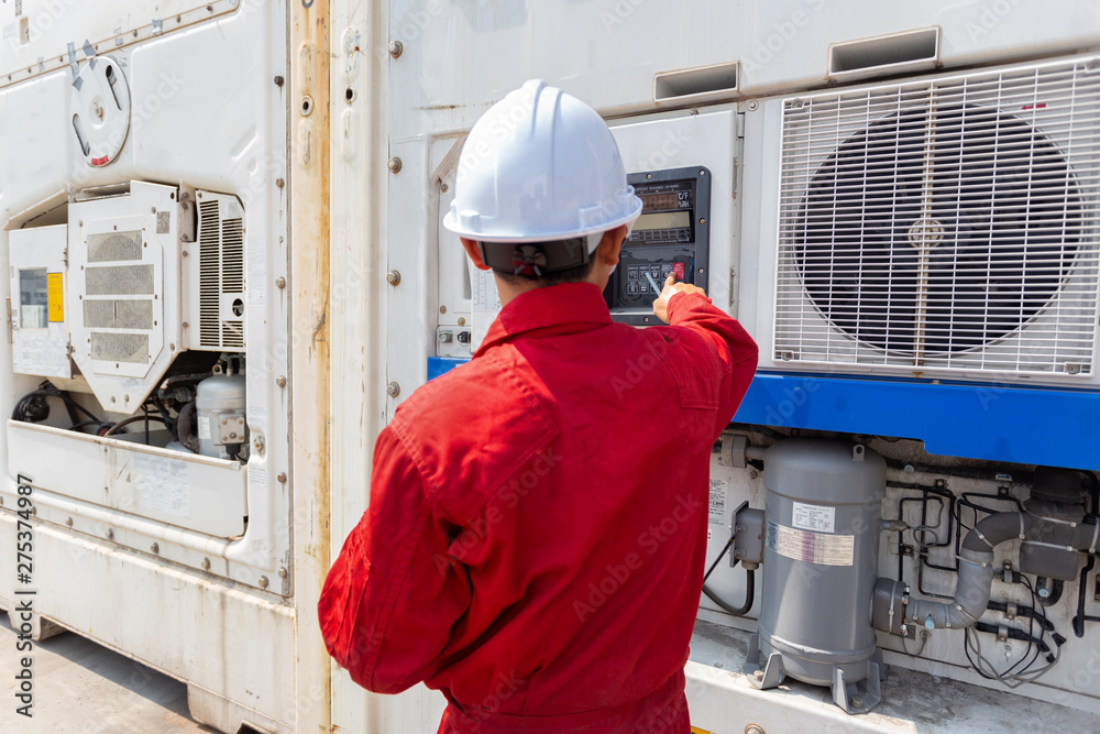 Technician setting system reefer container box is seriously working and