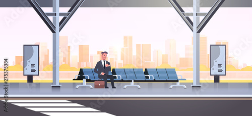 businessman sitting modern bus stop business man with suitcase waiting public transport on airport station cityscape background flat horizontal full length