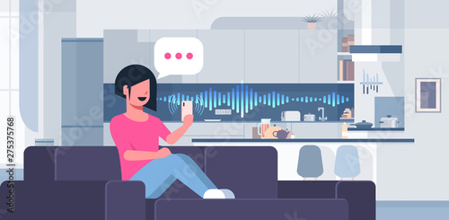 woman using smartphone smart speaker voice recognition concept chat bubble communication modern kitchen interior flat horizontal full length
