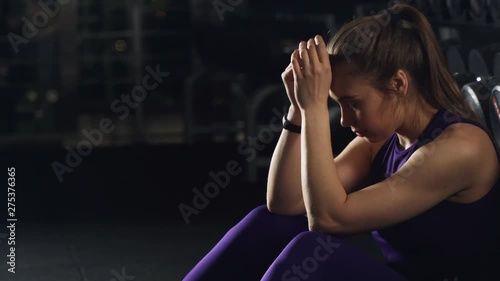Athletic Girl in sportswear taking breath tired exhausted disappointed after sports Exercise. Real emotions, the process of training, sporting achievements and failures