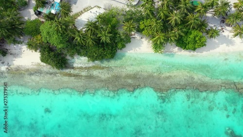 Overhead footage of the rocky turquoise waters of a beach in Antigua, with very transparent waters photo