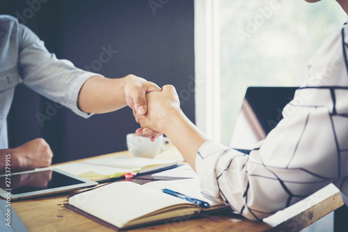 Business negotiation concept; Business people handshaking to sign contract of business at business meeting