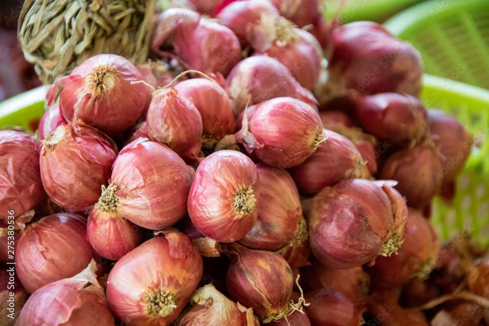 Shallots. Fresh purple shallots on basket. Shallots. Fresh purple shallots on basket.