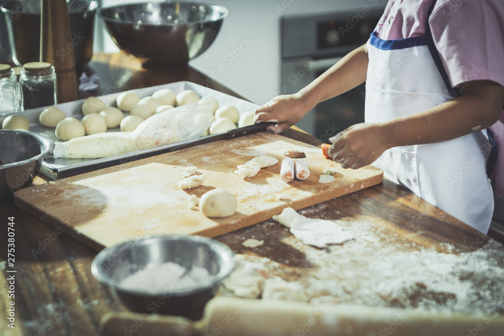happy family in kitchen. family knead dough and bake the bakery together in kitchen happy family in kitchen. family knead dough and bake the bakery together in kitchen