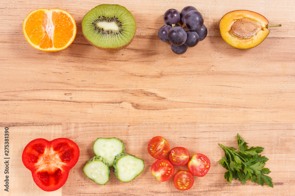 Frame of healthy nutritious fruits and vegetables as source minerals, vitamins and fiber, place for text Frame of healthy nutritious fruits and vegetables as source minerals, vitamins and fiber, place for text