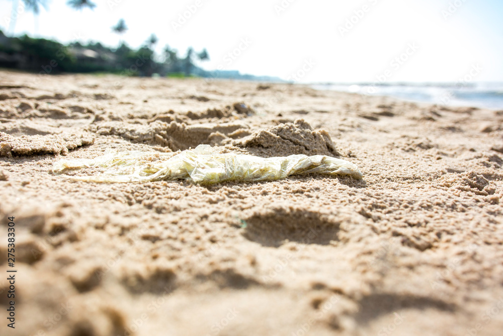 Plastic bag trash polluting a sandy beach vietnam Plastic bag trash polluting a sandy beach vietnam