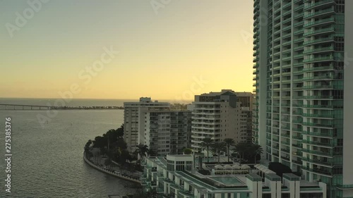 Cinematic Aerial Shot Of Iconic Building In Brickell Drive in Miami Florida At Sunset During Golden Hour photo