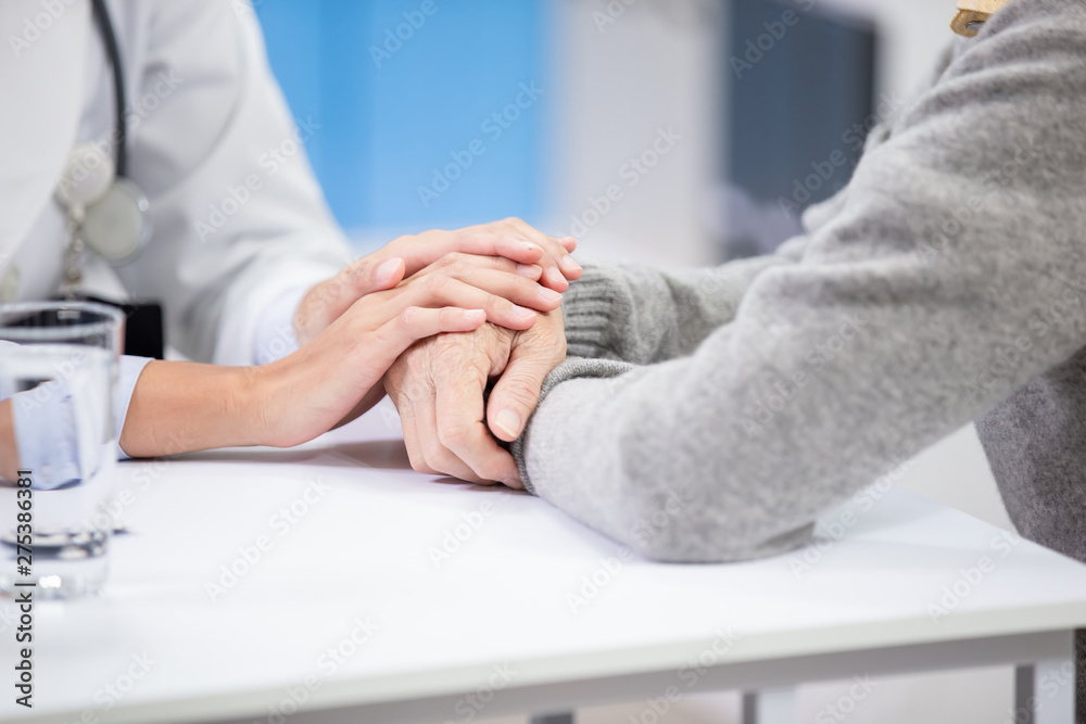 Female doctor see elder patient Female doctor see elder patient