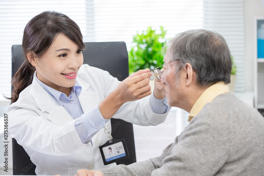 Fototapeta premium Female ophthalmologist see patient