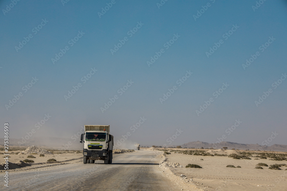Trucks passing through the desert