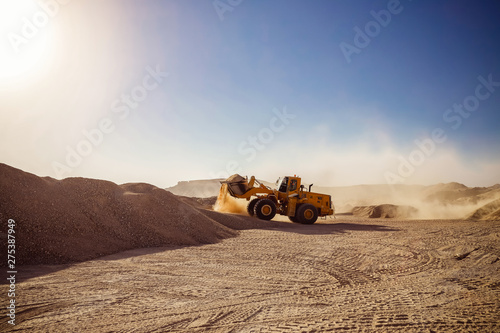 Bulldozers and earthmovers working in quarries