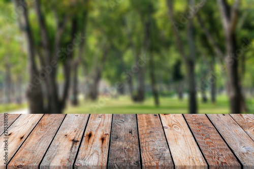 wooden table over blurred background for show your product on image