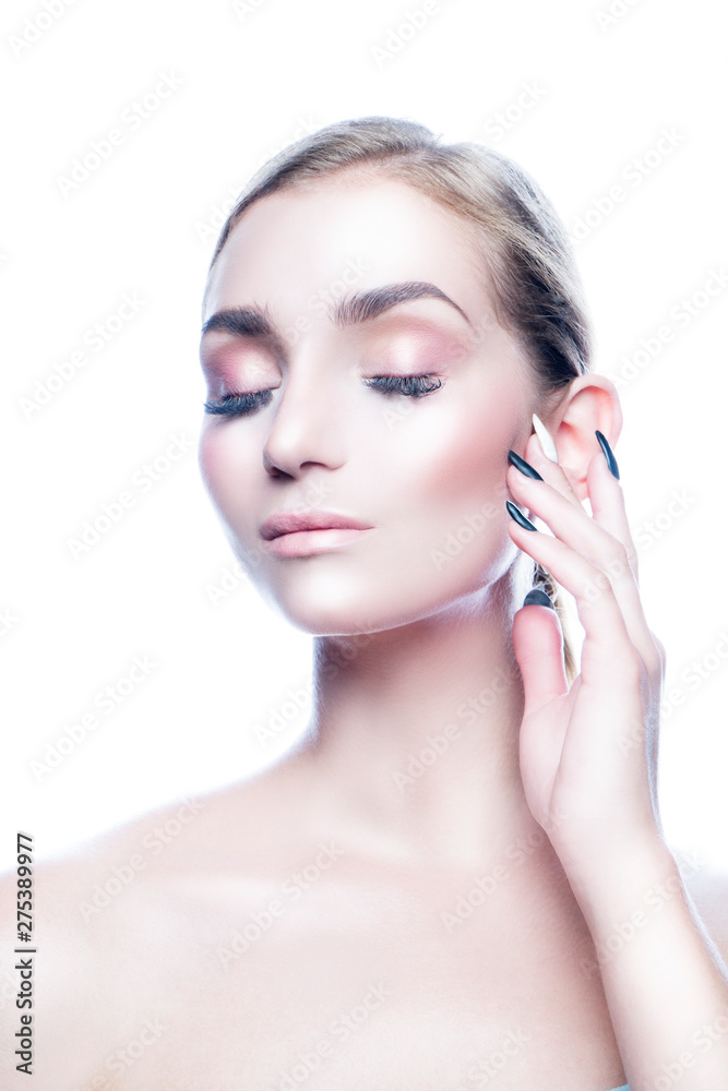 portrait of young woman with perfect skin, closed eyes, artificial eyelashes. White background. Copy space. Isolated
