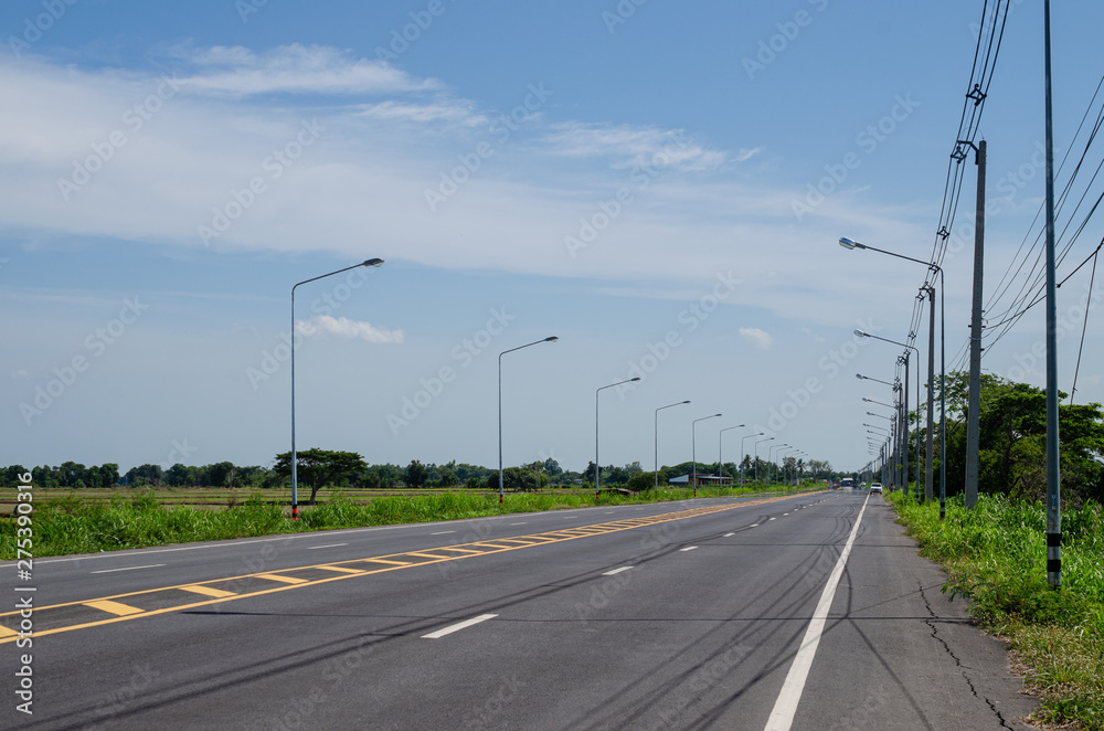 Asphalt road with electric pole in rural Thailand Asphalt road with electric pole in rural Thailand