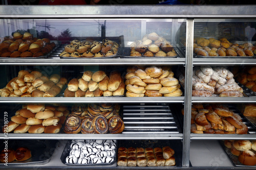 Assorted bread and pastry on display at a bakeshop