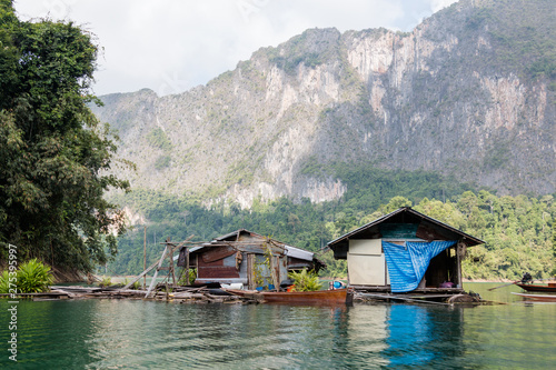Tropical lakeside hut in ratchaprapa dam or Cheow Lan Dam Suratthani, Thailand. © wassamon