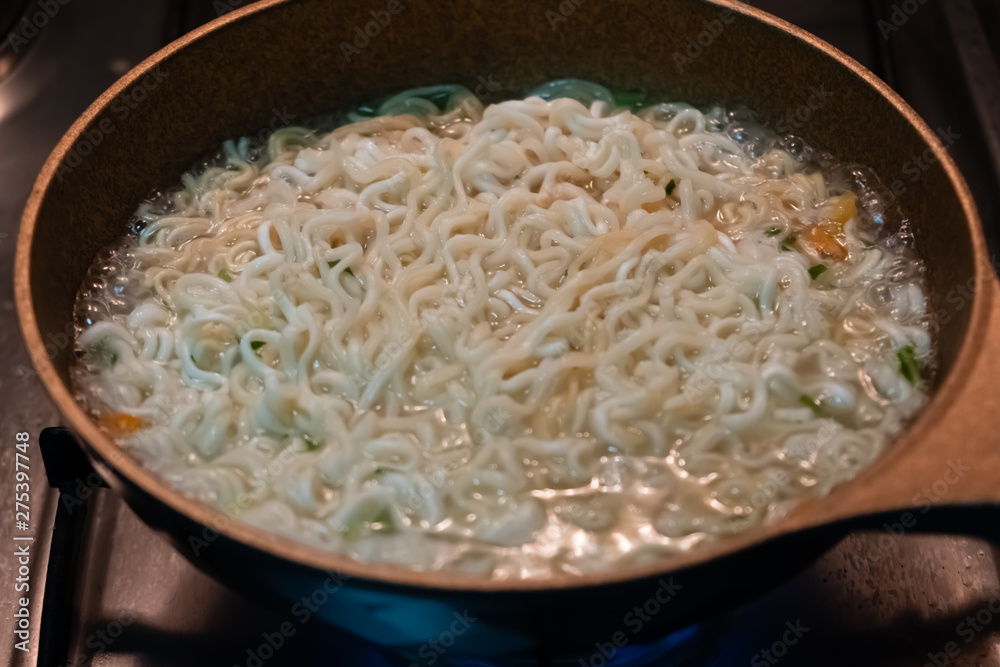Instant noodles in hot water. Instant noodles in hot water.