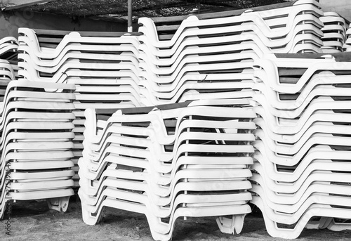 loungers for relaxing on the beach neatly stacked