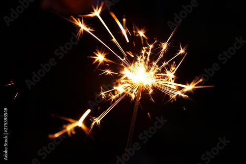 burning sparkler firework. Happy new year and Merry christmas concept. Happy holidays. Abstract blurred of Sparklers for celebration. Magic light. Winter Xmas decoration. Realistic Party light effect