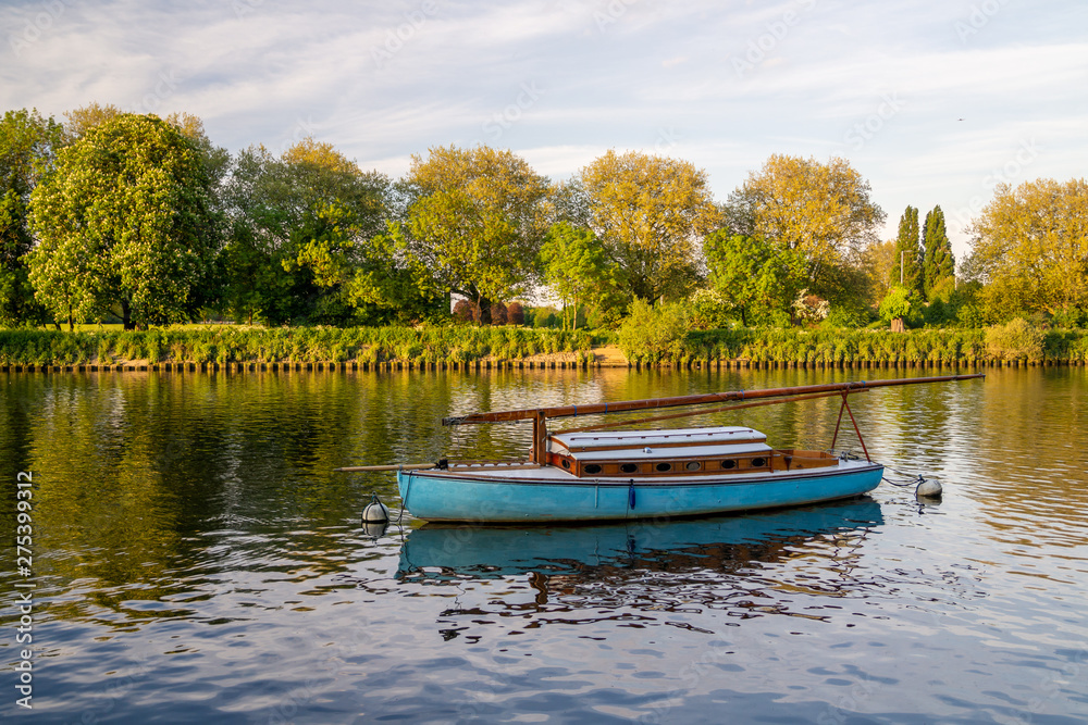 Boat anchored long the Thames in Richmond-upon-thames, England Boat anchored long the Thames in Richmond-upon-thames, England