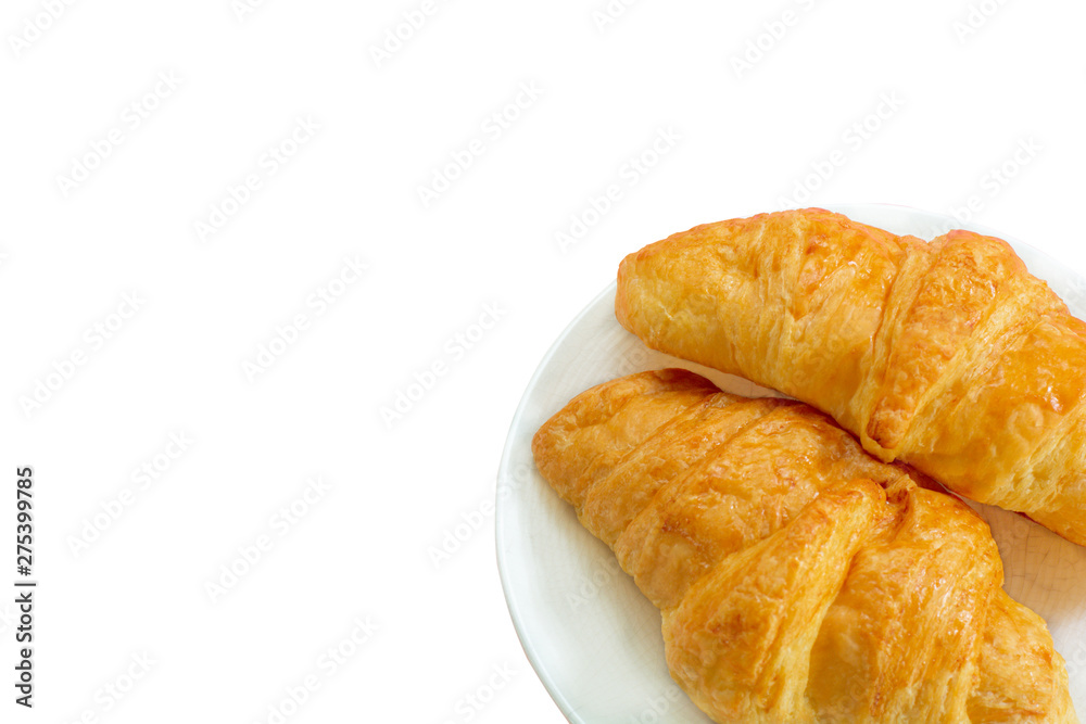 Two croissants on white dish with copy space for your text isolated.