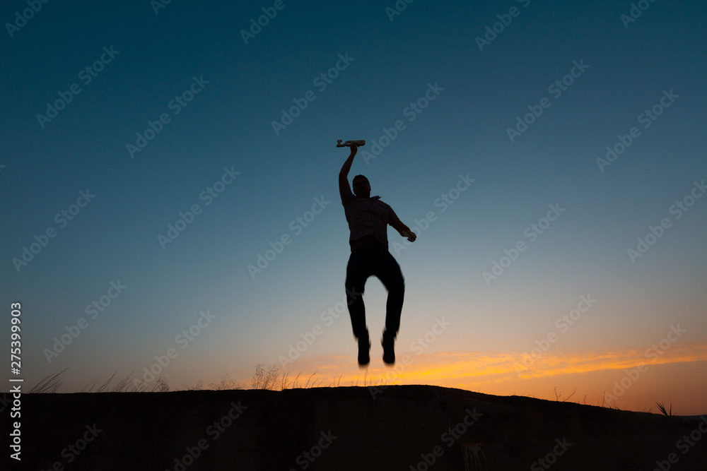 silhouette of man with poster that puts love