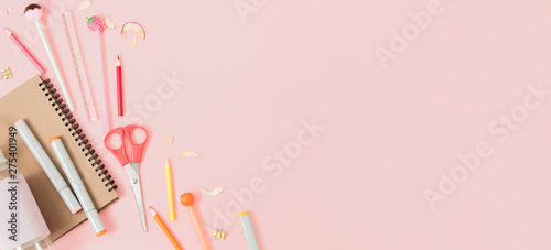 Colorful stationery on pastel pink background, school concept